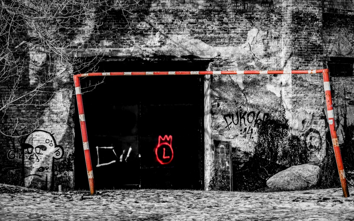 Horizontal monochrome field in dark gray tones, with stark contrast, hard edges, and a layered field